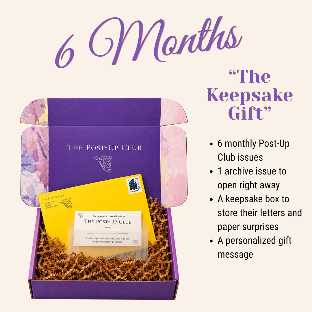 Promotional graphic for The Post-Up Club's 'The Keepsake Gift' 6-month box set. It shows an open purple cardboard box filled with brown crinkle paper, containing a yellow envelope and a small card.